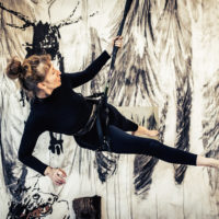 La Louve, Performance accroche sur potence, 15 mn, 13 Février 2018, création collectif dessin envolé, Sandra Ancelot en mouvement, suspendue sur la potence d’Armand Lestard et Stephan Ink création sonore. Exposition collective « La louve, Sauvage » Centre d’art Aponia, Villiers sur Marnes, 13 Février au 11 Février 2018, Commissaire d’exposition Armand Lestard, Sandra Ancelot, Hélène Singer, Franck Lestard, masques,  Eric Angenot Rémi Voche, Armand Lestard © Ludovic Picard